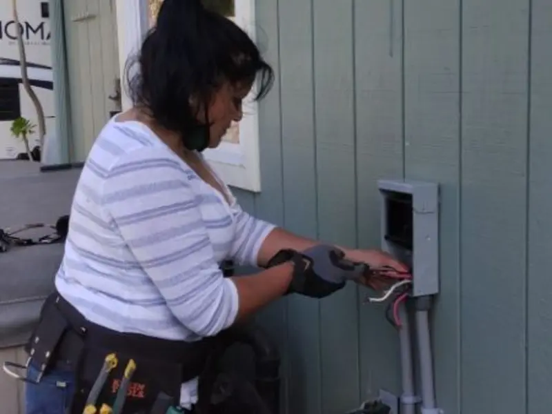Licensed electrician wiring an exterior subpanel in Spring Valley