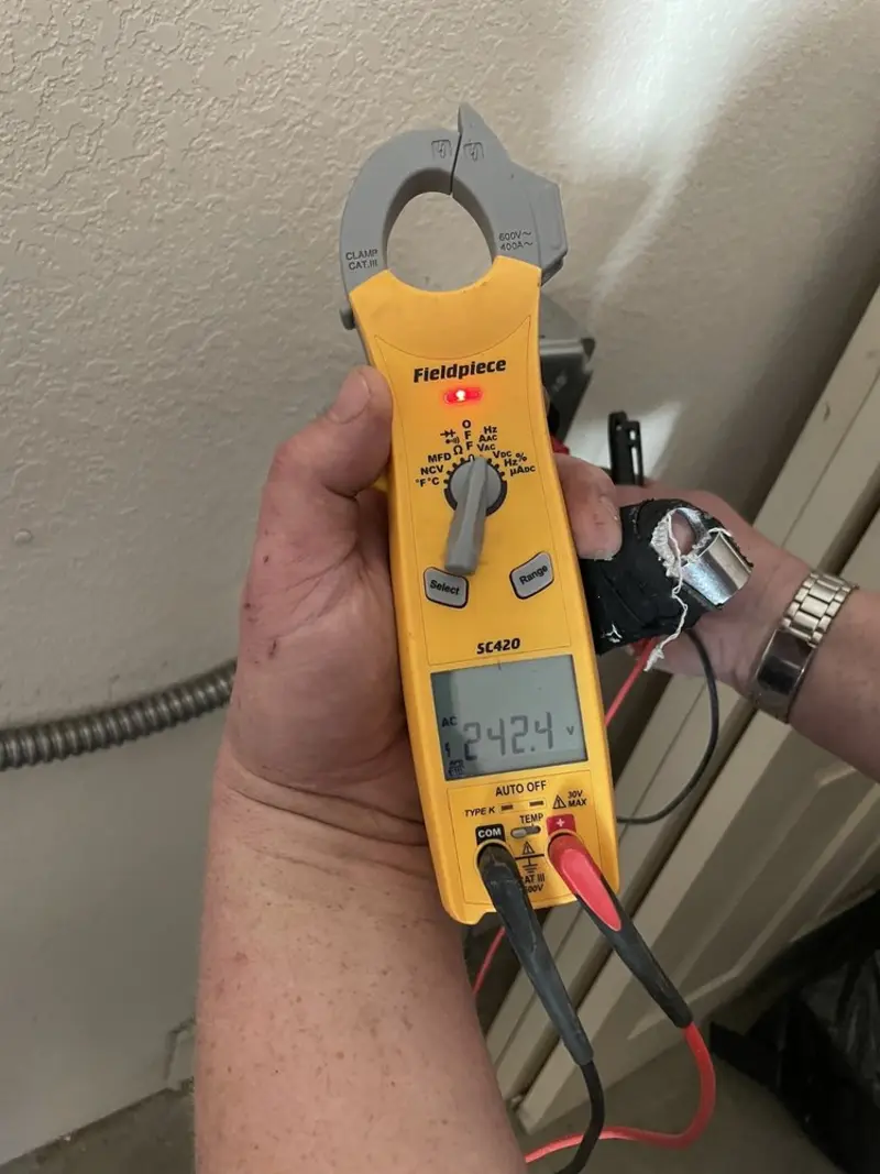 Voltage testing with clamp meter during Outlet Installation in Spring Valley
